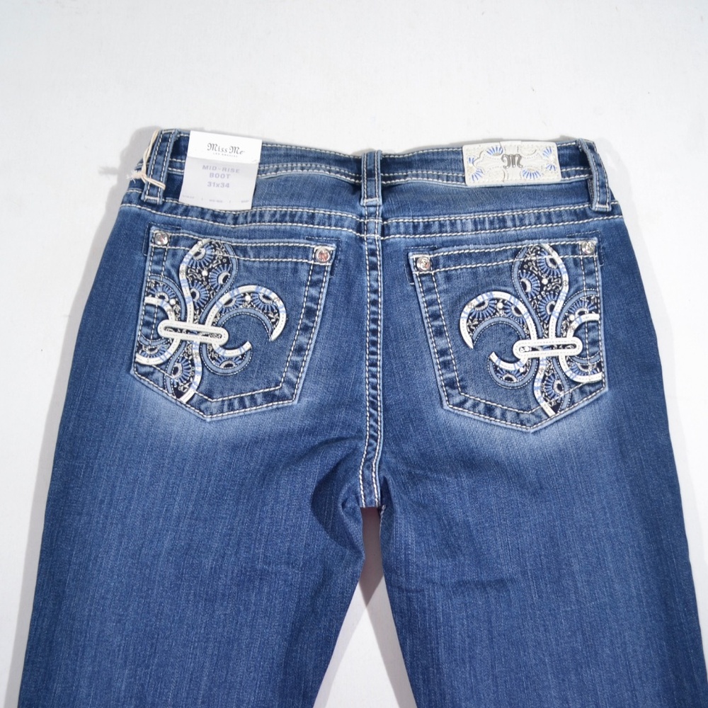 NWT MISS ME MID-RISE BOOTCUT JEANS, FLEUR DE LIS, SZ 31
